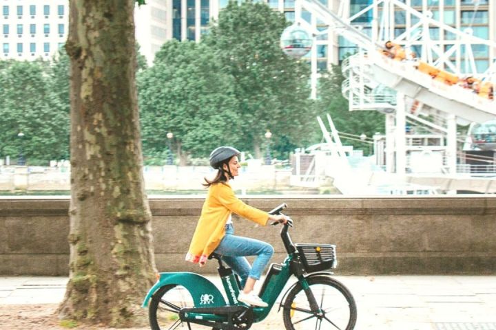 a person riding a bicycle on the side of a road