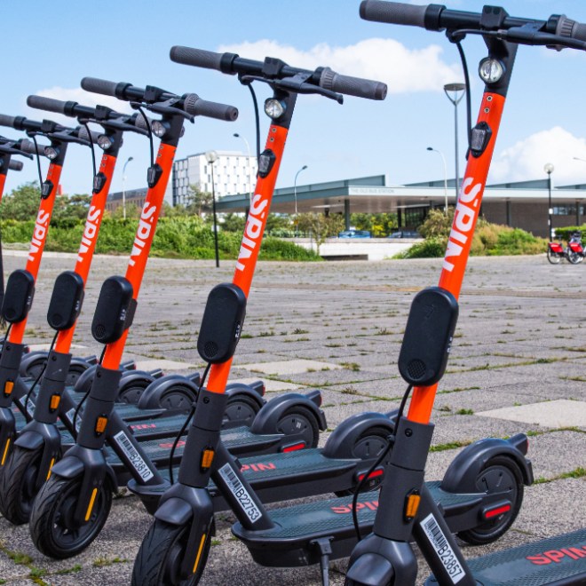 a group of people riding skis on a snowy road