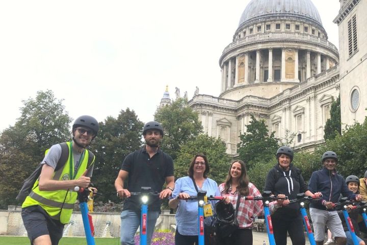 a group of people standing in front of a crowd posing for the camera