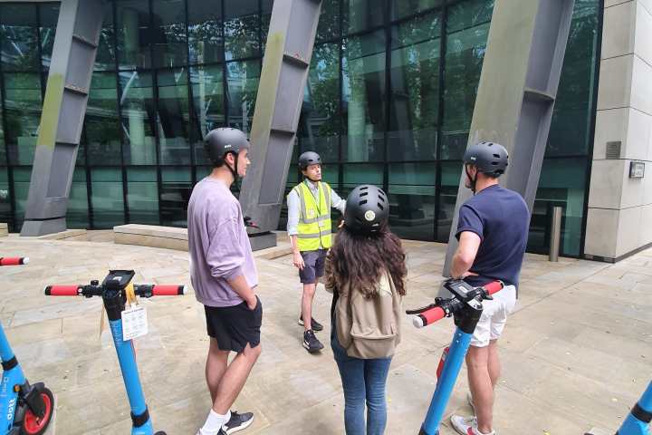 a group of people standing in front of a building