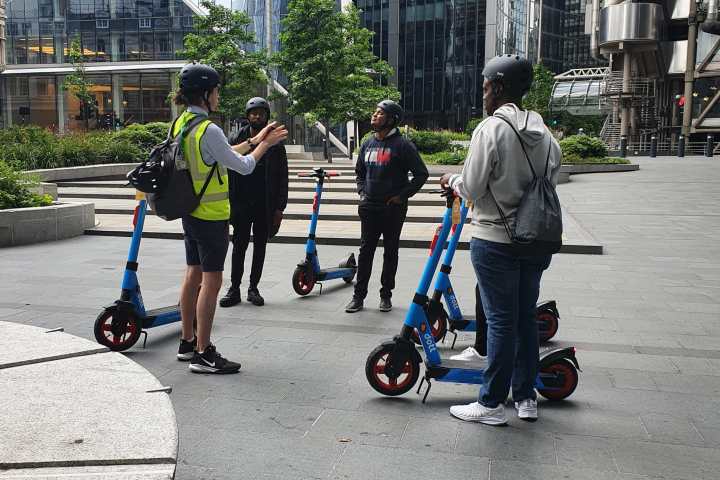 a group of people on a sidewalk