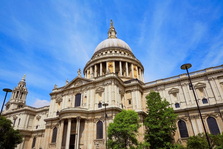 a large stone building with St Paul's Cathedral in the background