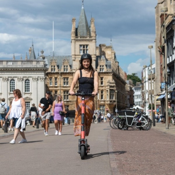 a group of people walking on a city street