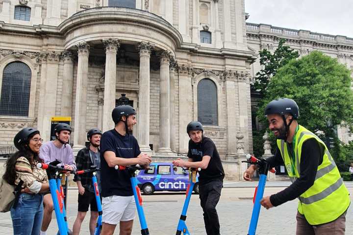 a group of people walking in front of a building