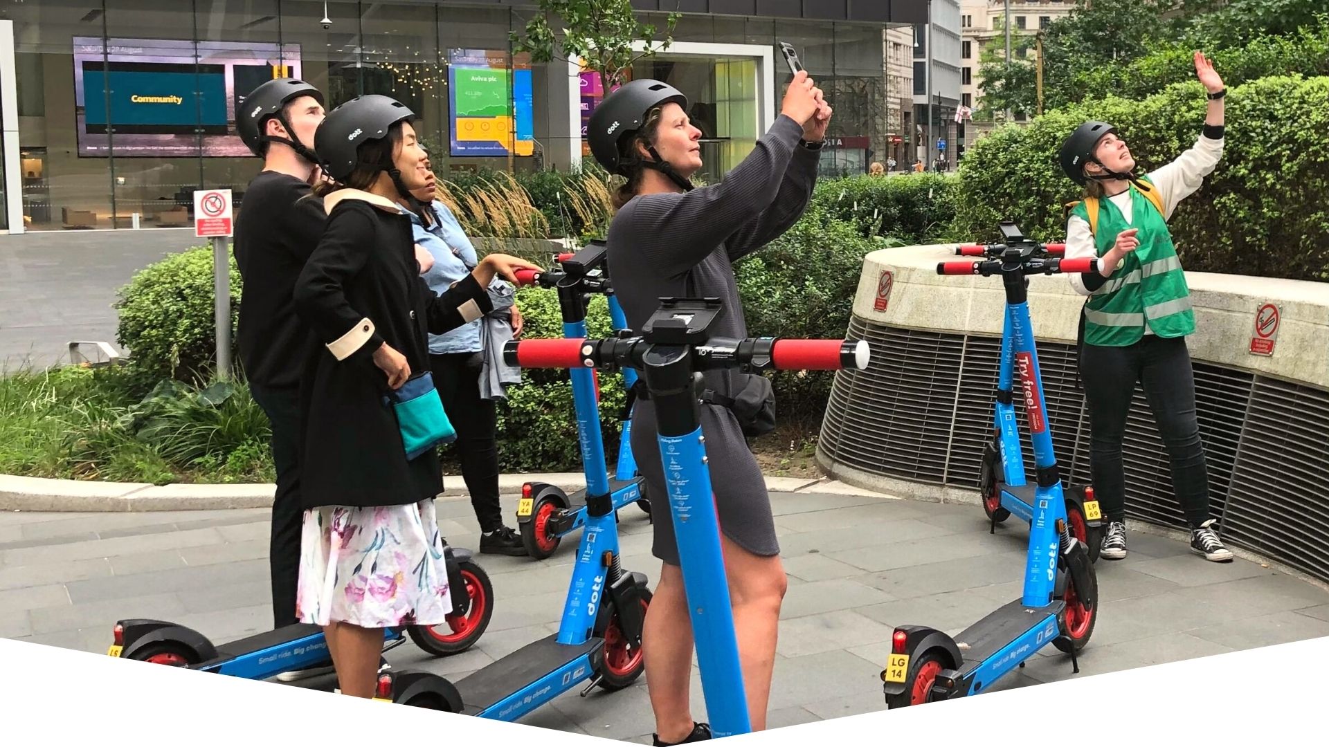 a group of people standing next to a person