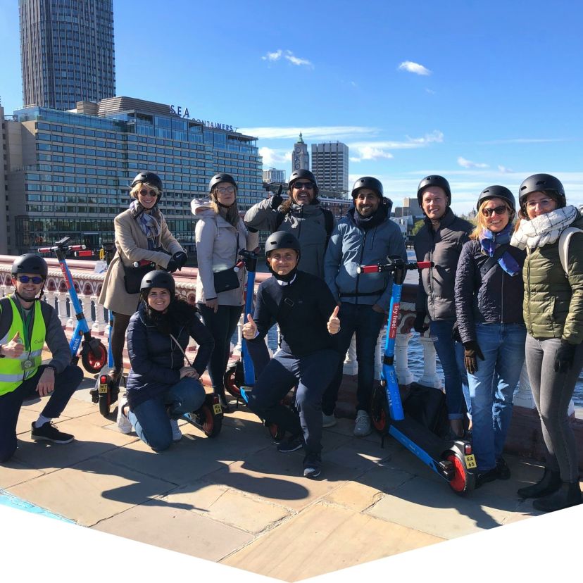 a group of people standing in front of a crowd posing for the camera