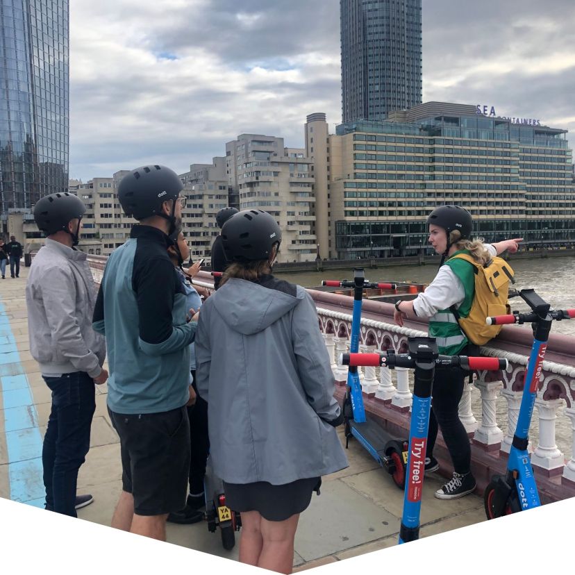 a group of people standing in front of a building