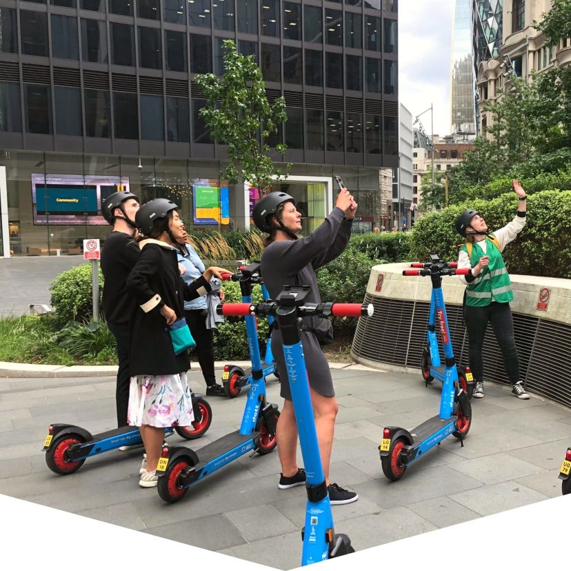 a group of people on a sidewalk