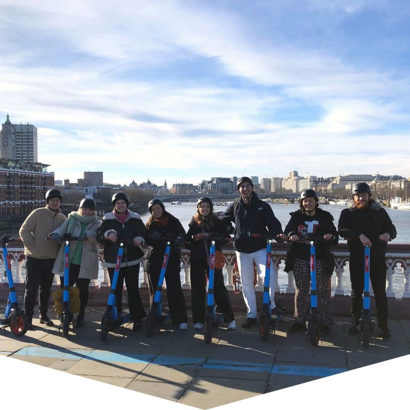 a group of people standing in the snow