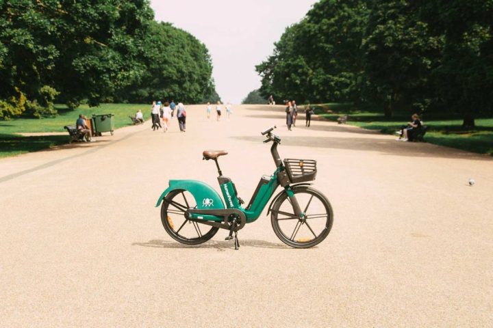 a bicycle parked on the side of a road