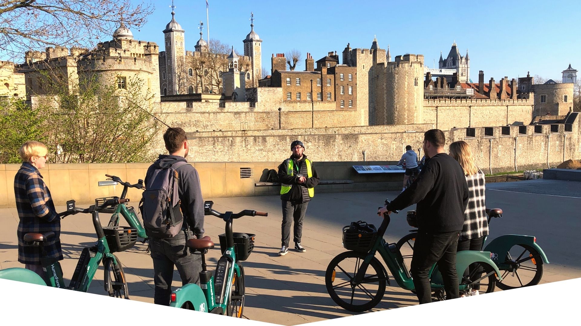 a group of people riding on top of a building