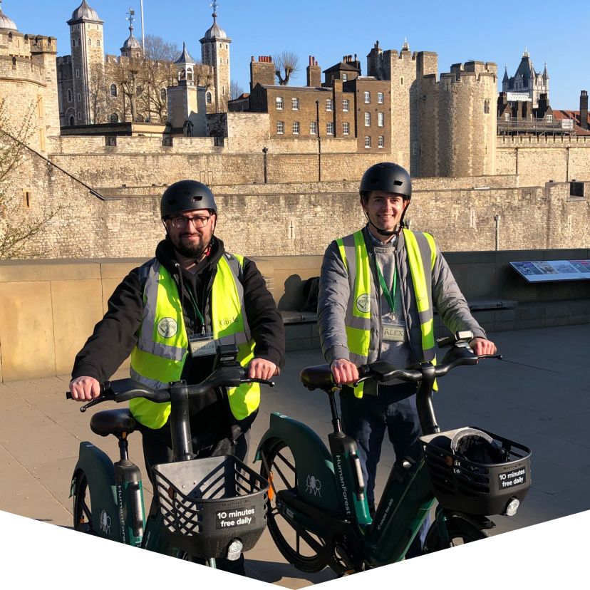 a group of people sitting in front of a building